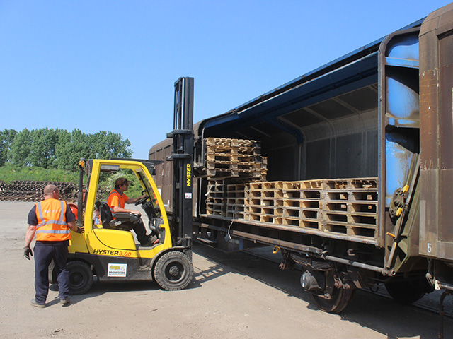 Pallets being loaded onto railway van